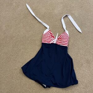 Retro navy and white/red stripes with skirt and hidden shorts bottom. One piece